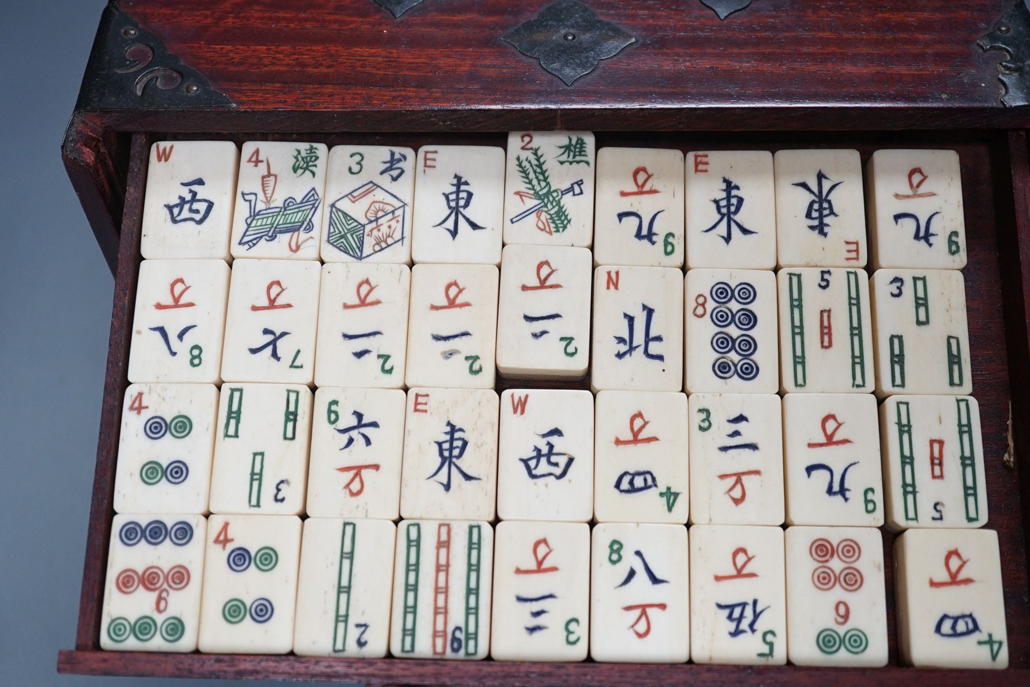 A MahJong set and a Chinese brass mounted card case., MahJong set, 15.5 cms high x 23.5 cms wide.